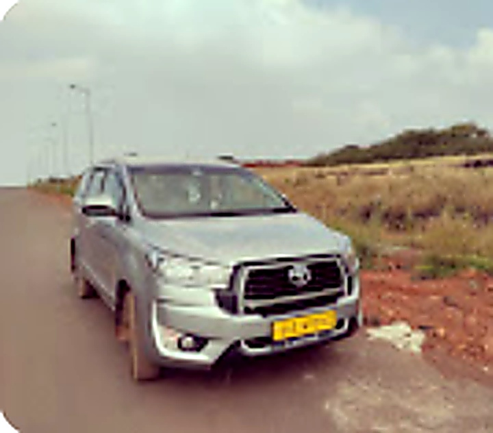 Swami Cab Service Toyota Innova Crysta on scenic Goa coastal road